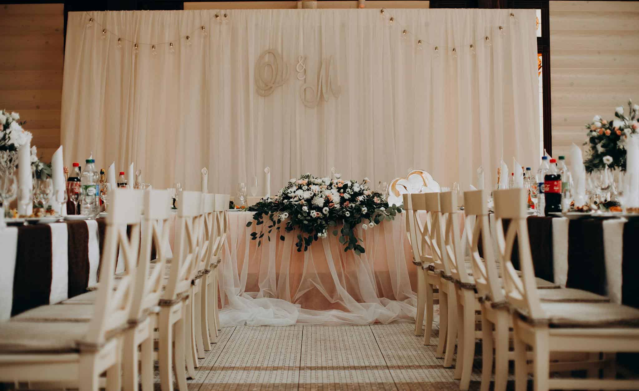 Beautiful and elegant wedding setup featuring floral arrangements, classy chairs, and a serene atmosphere.